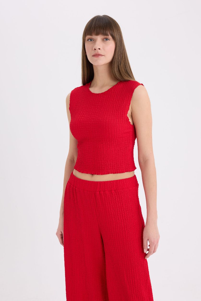 FEMME Rouge Pantalon large en tissu gaufré