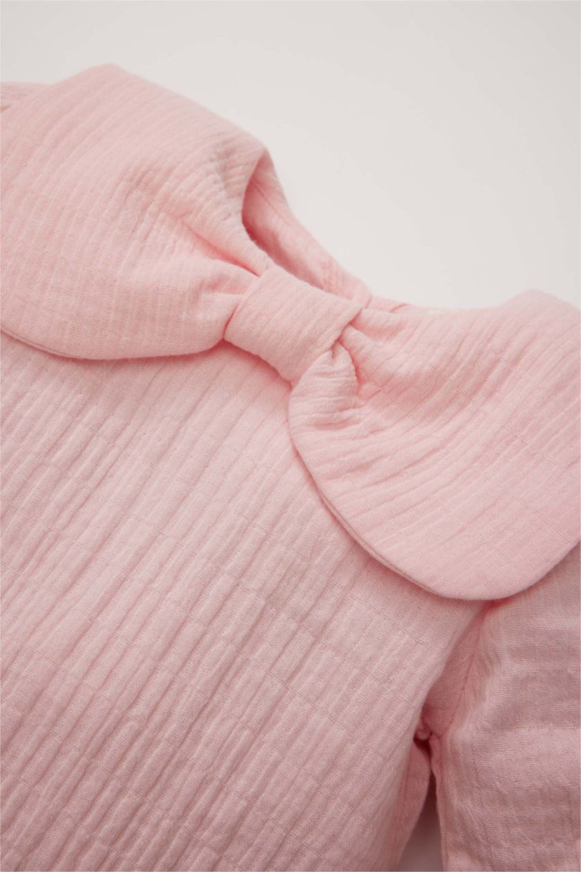 طفلة صغيرة زهري فاتح قميص بنات كم طويل من موسلين بقصة عادية