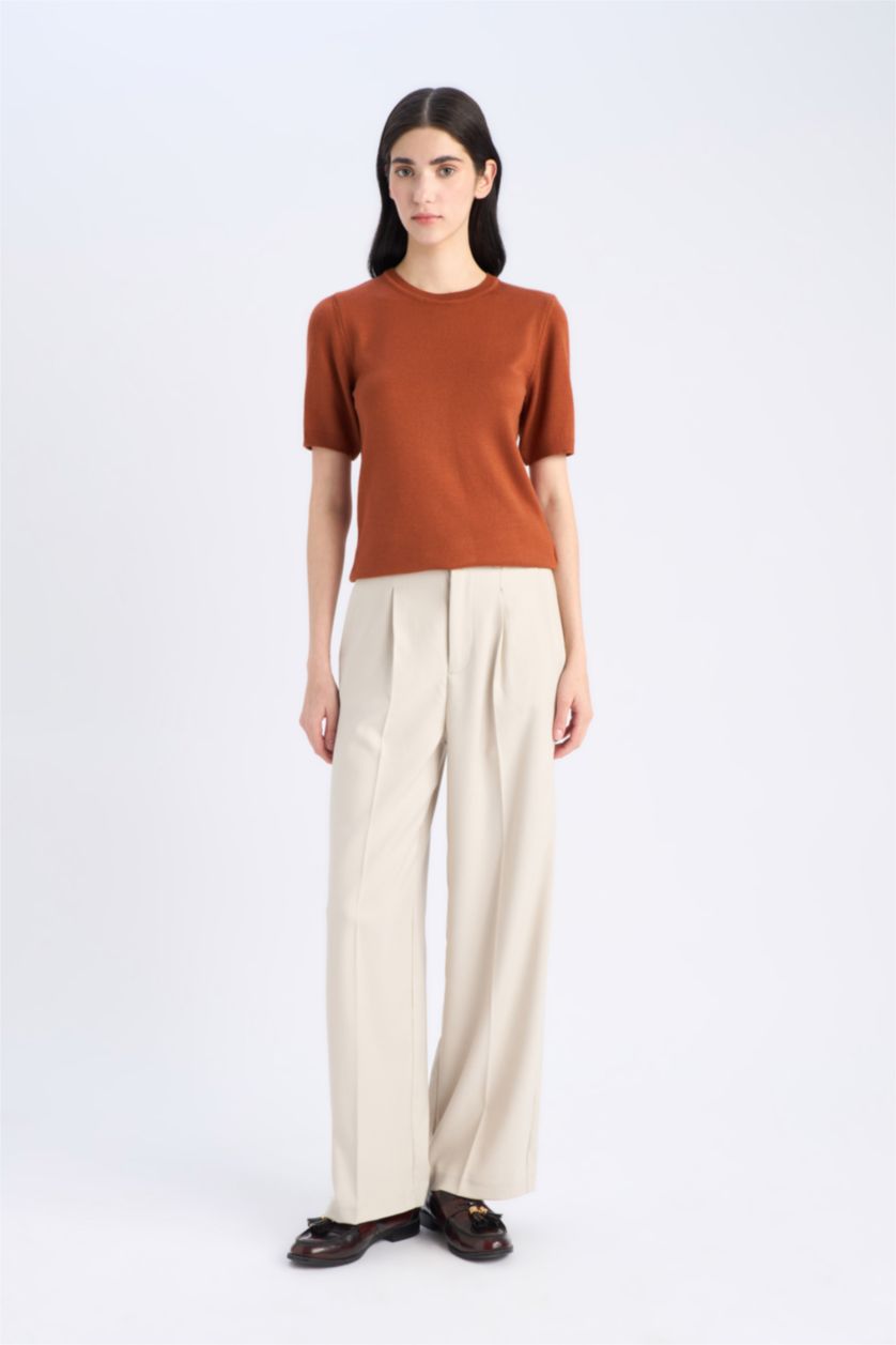 حريمي برتقلي غامق بلوفر تريكو سادة بيزك قصة عادية بياقة مستديرة