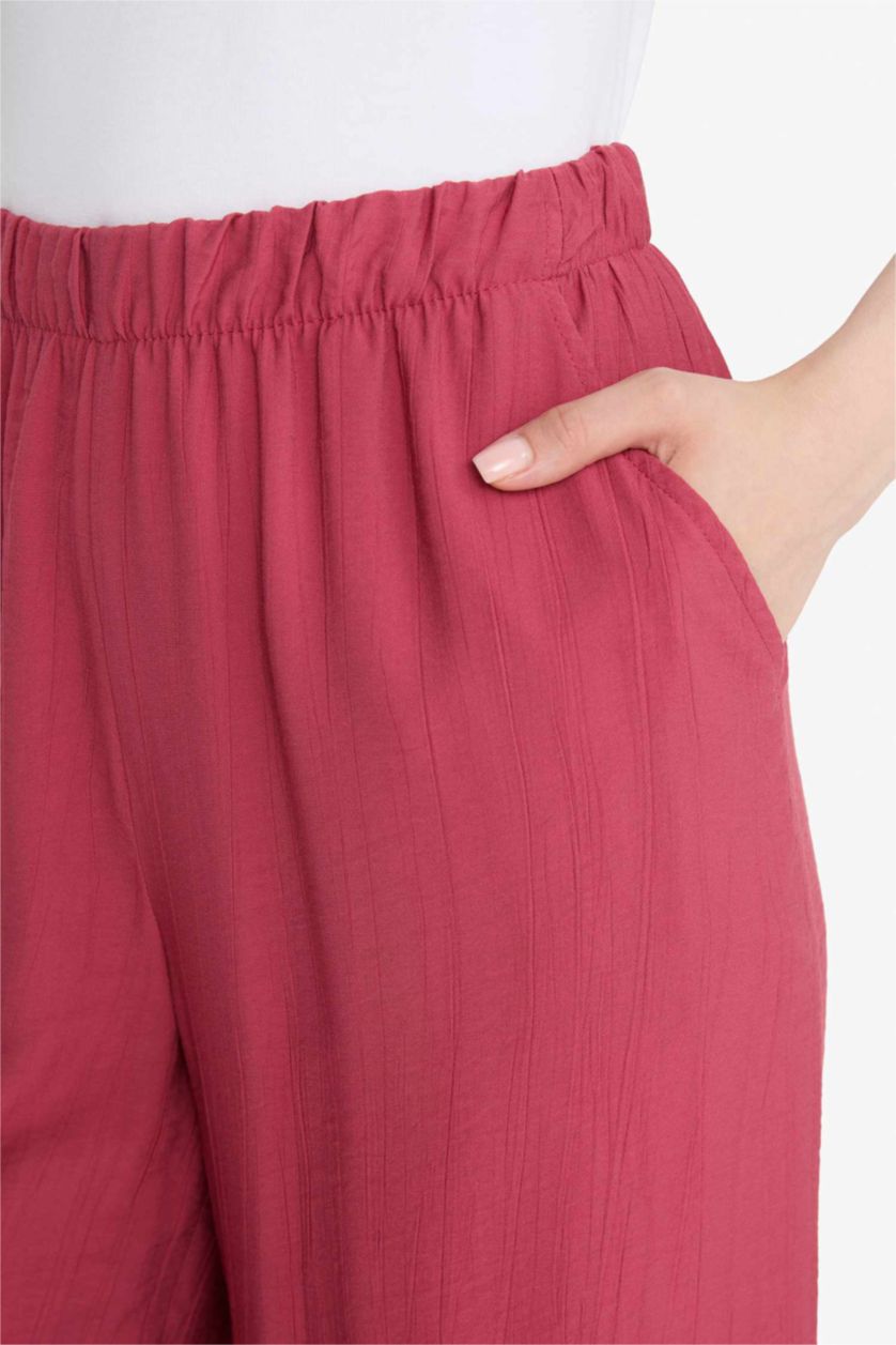 نساء خمري فاتح بنطرون قماش كرنكيل برجل واسع وايد ليج