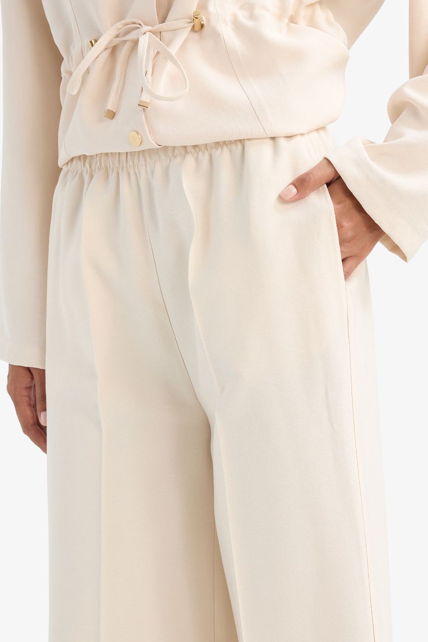 نساء حجري فاتح بنطلون قماش ايوسل قصة مستقيمة بجيب وخصر عالي