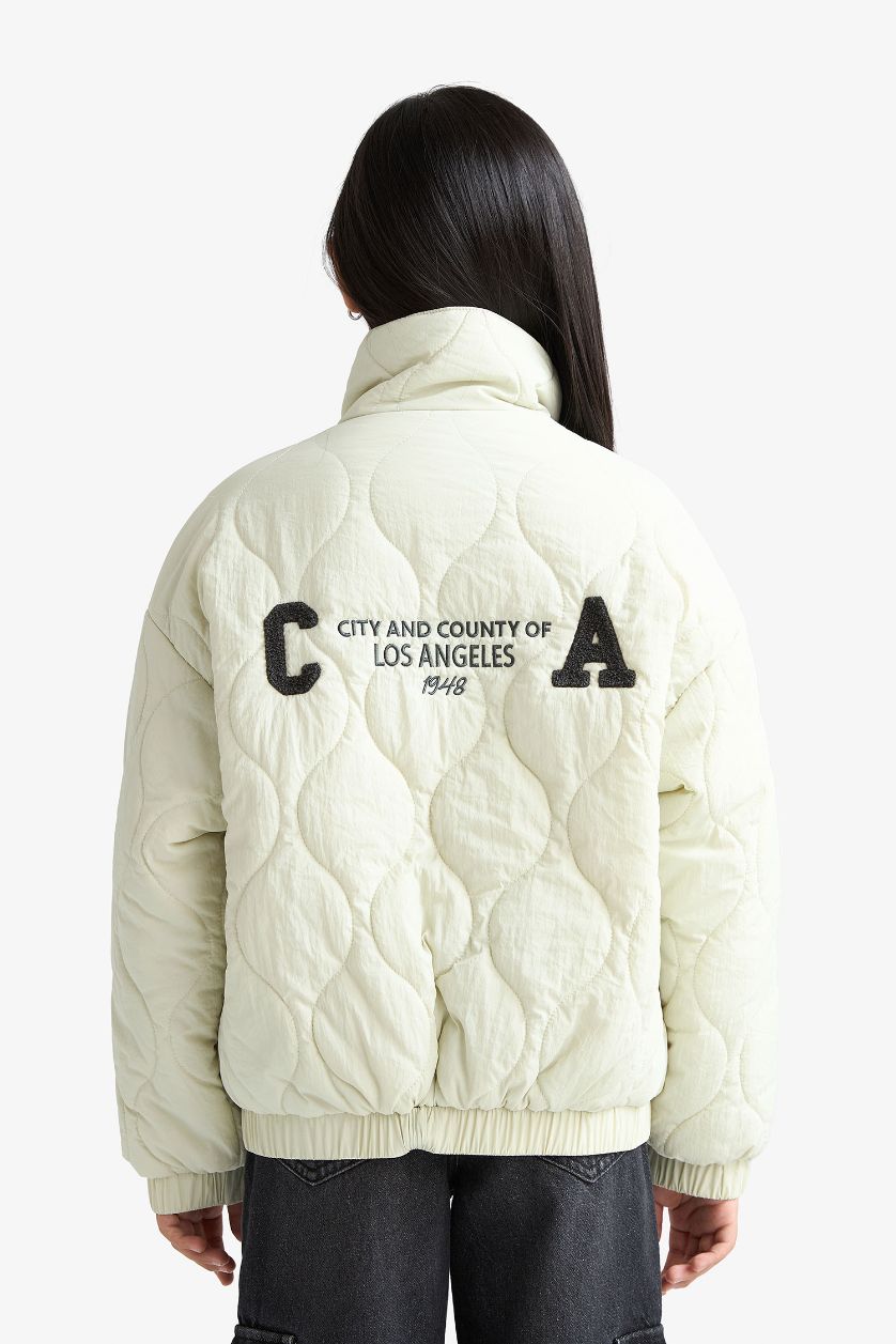 بناتي نعناعي فاتح جاكيت بامب بناتي وتر بروف بطبعة من الخلف