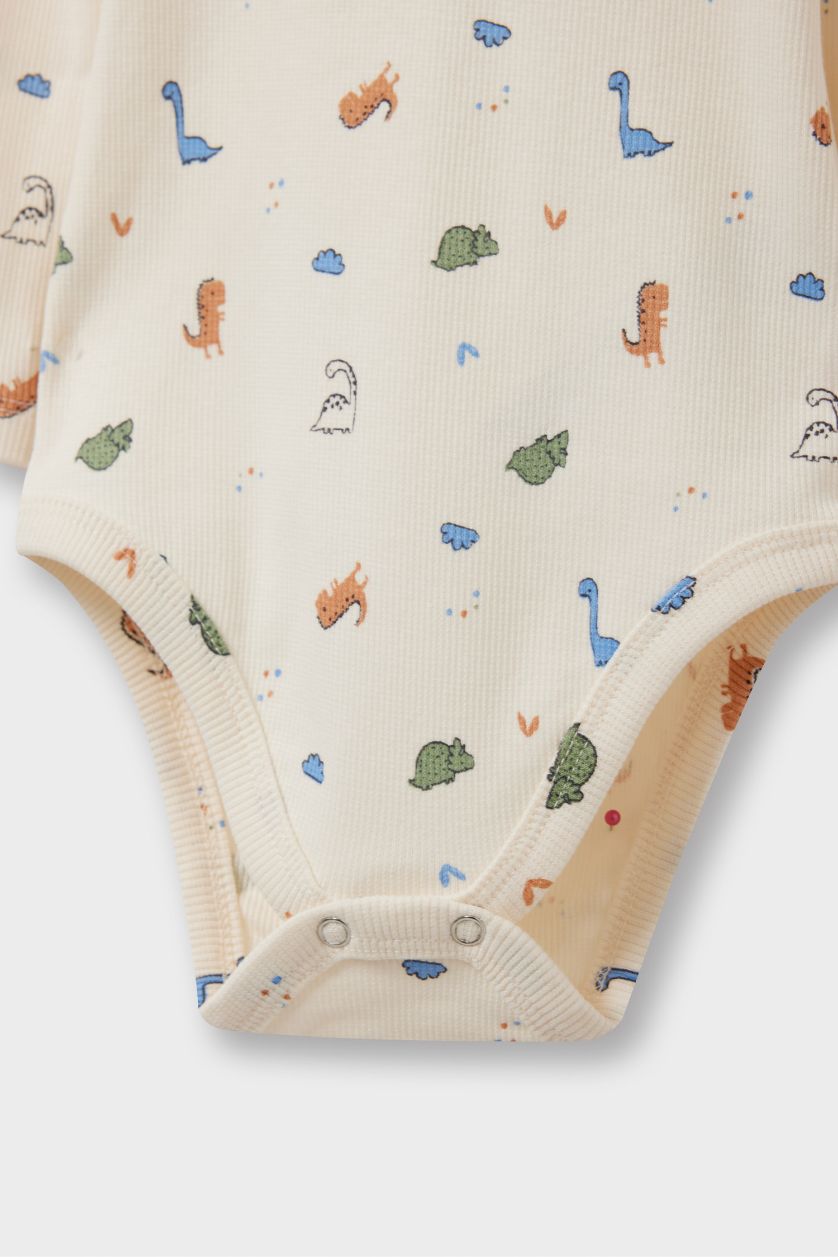 طفلة صغيرة بيج فاتح سيت بيبي ولادي اوفر وبنطلون مضلع بطبعة ديناصور - قطعتين