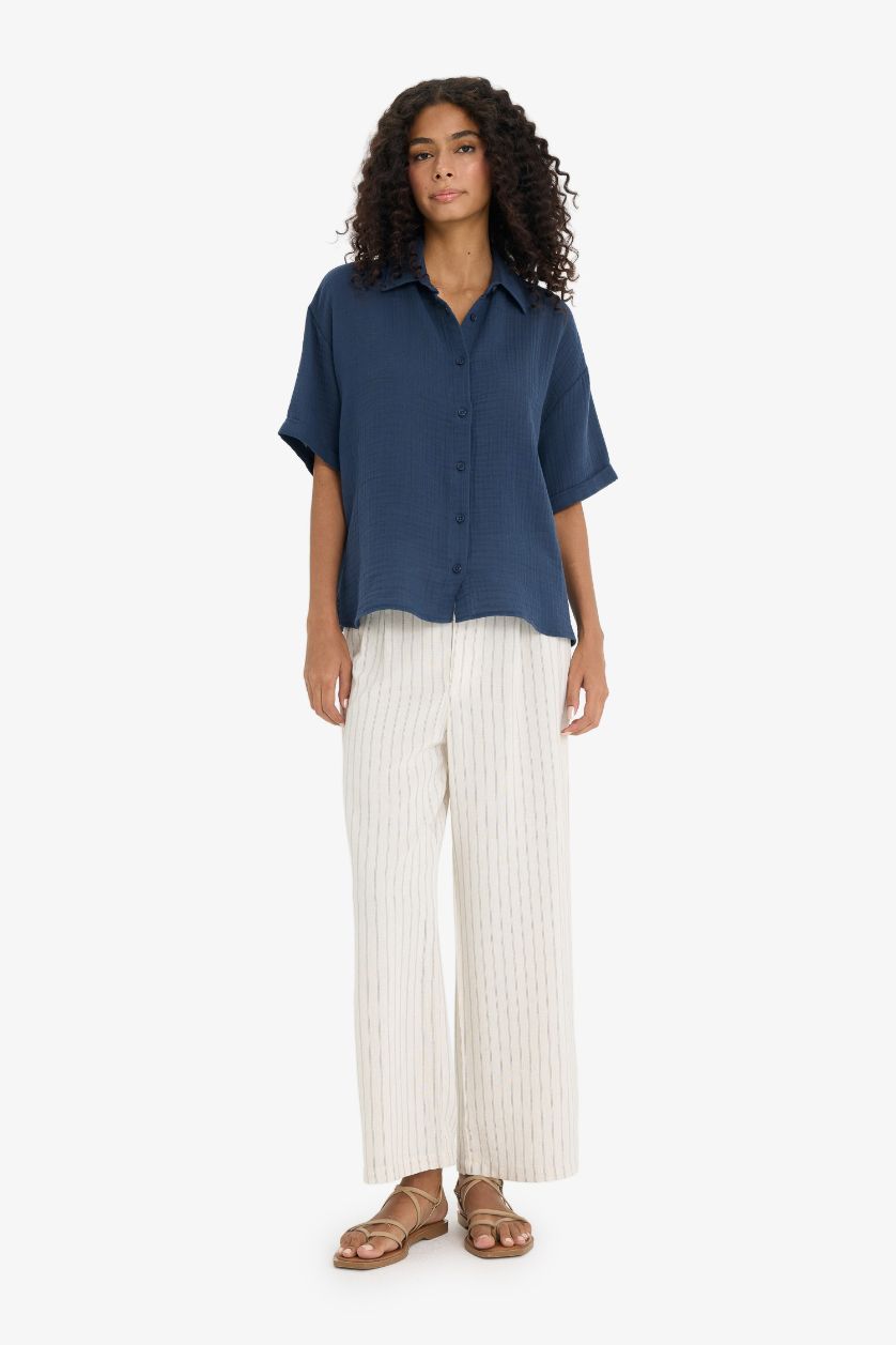 نساء كحلي فاتح قميص نص ردن موسلين قصة عادية