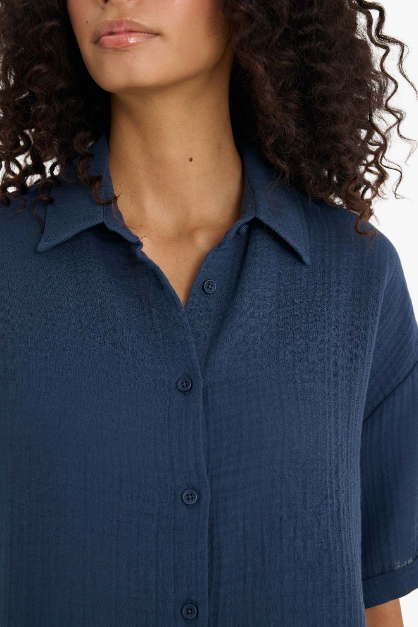 نساء كحلي فاتح قميص نص ردن موسلين قصة عادية