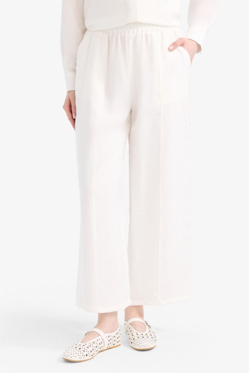 حريمي بيج فاتح بنطلون بيزك سادة برجل عادية