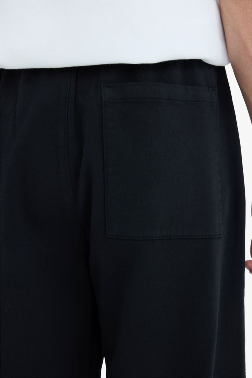 MAN Black Wide Leg Regular Hem Zip-Up Trousers