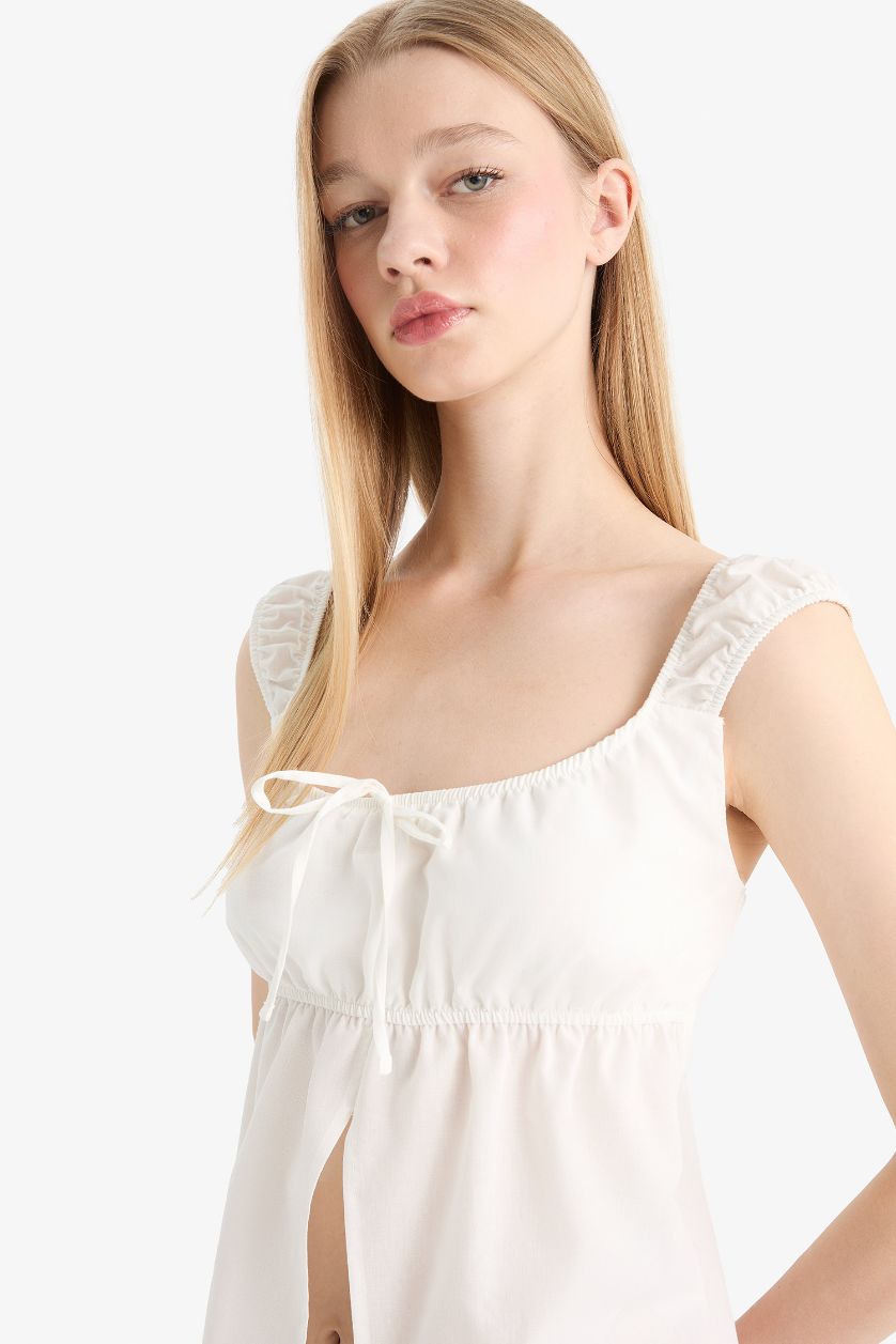 نساء اوف وايت بلوزة بدون أكمام سليم فيت