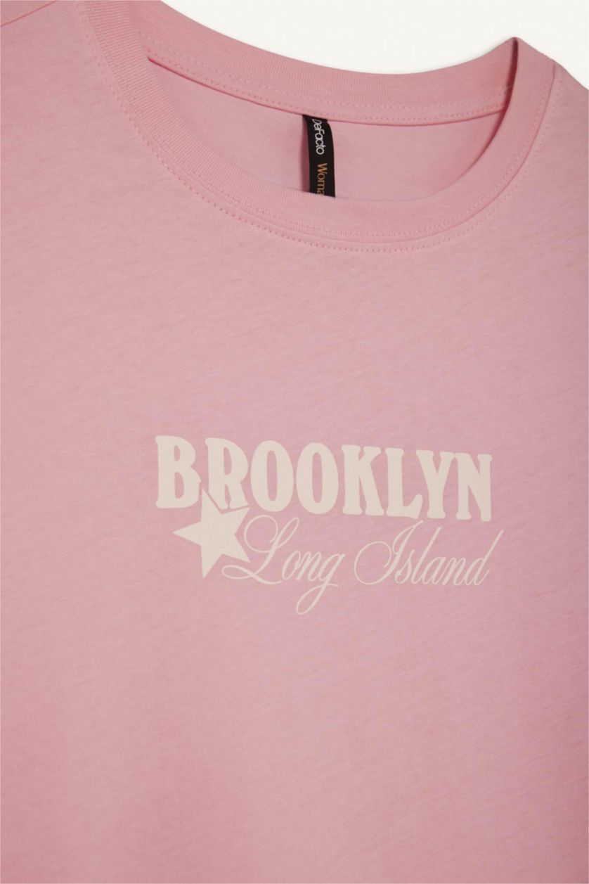 نساء زهري فاتح تيشيرت نص ردن ممشط قصة عادية وياخة مستديرة