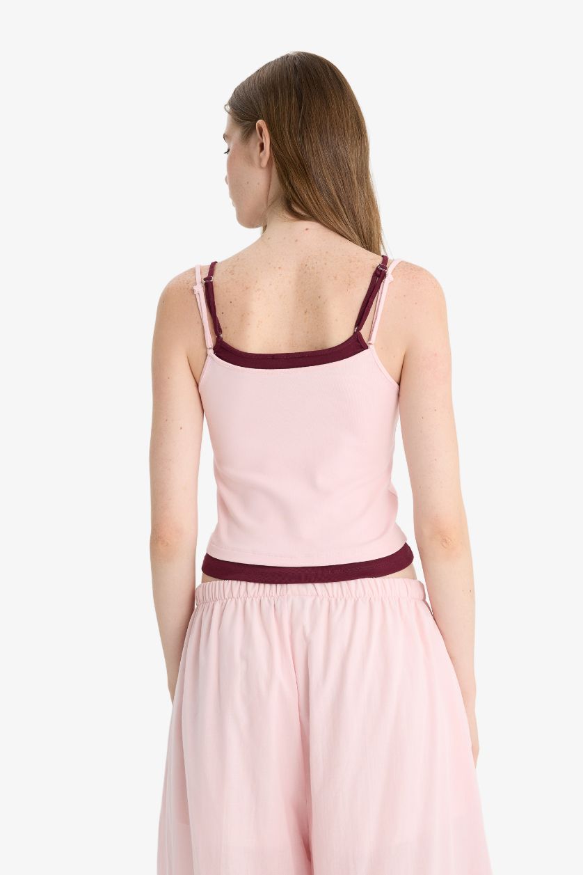 حريمي زهري تانك توب مضلع مخصر سليم فيت بياقة U