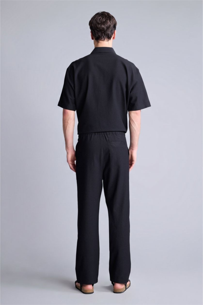 MAN Black Baggy Fit Trousers