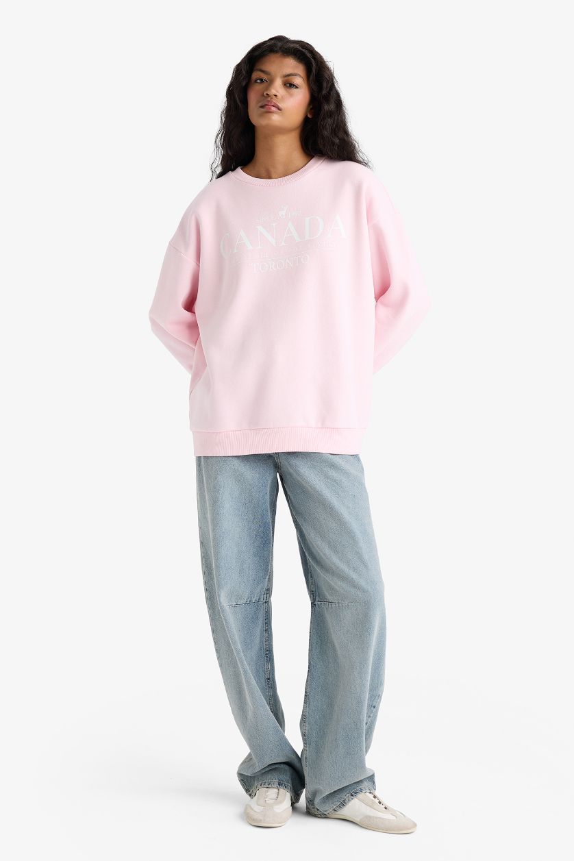 نساء زهري فاتح سويت شيرت برسمة مدينة اوفر سايز بياقة مستديرة