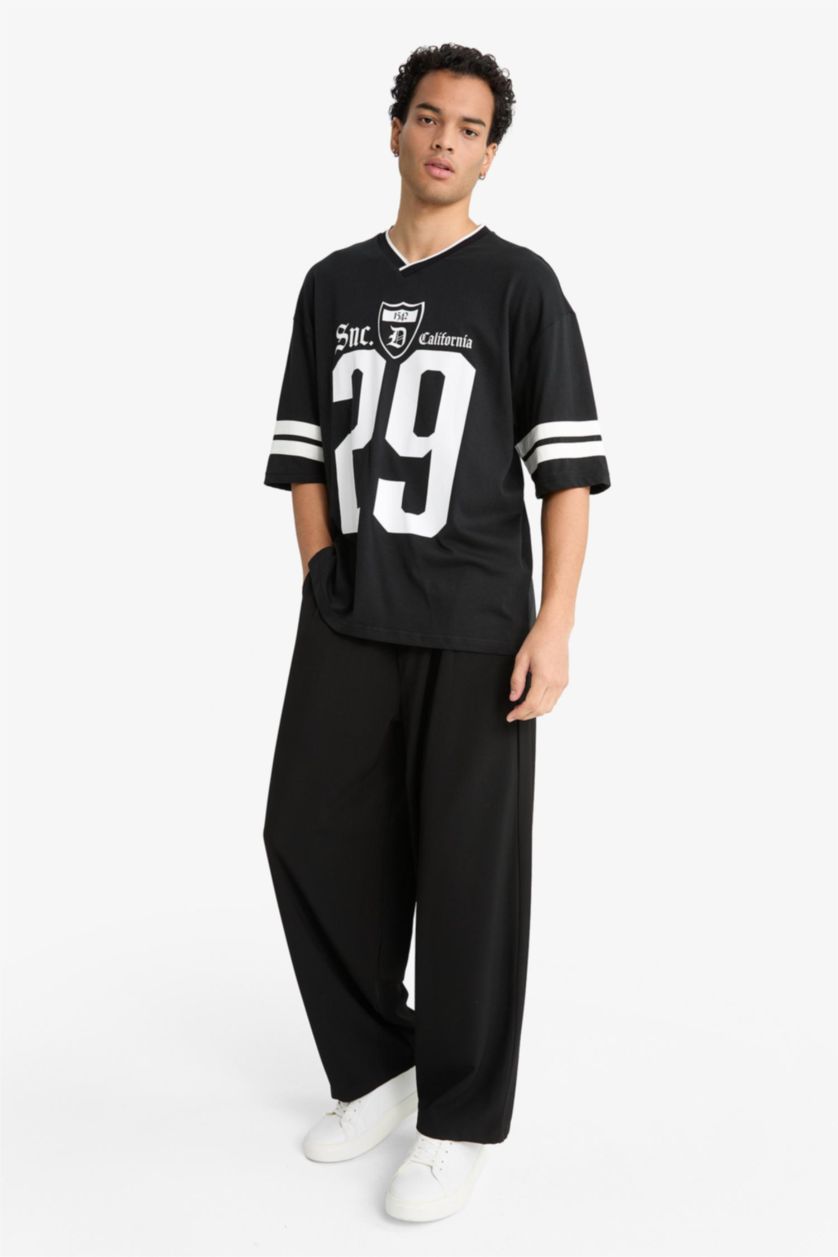 MAN Black Barrel Fit Wide Straight Leg Trousers