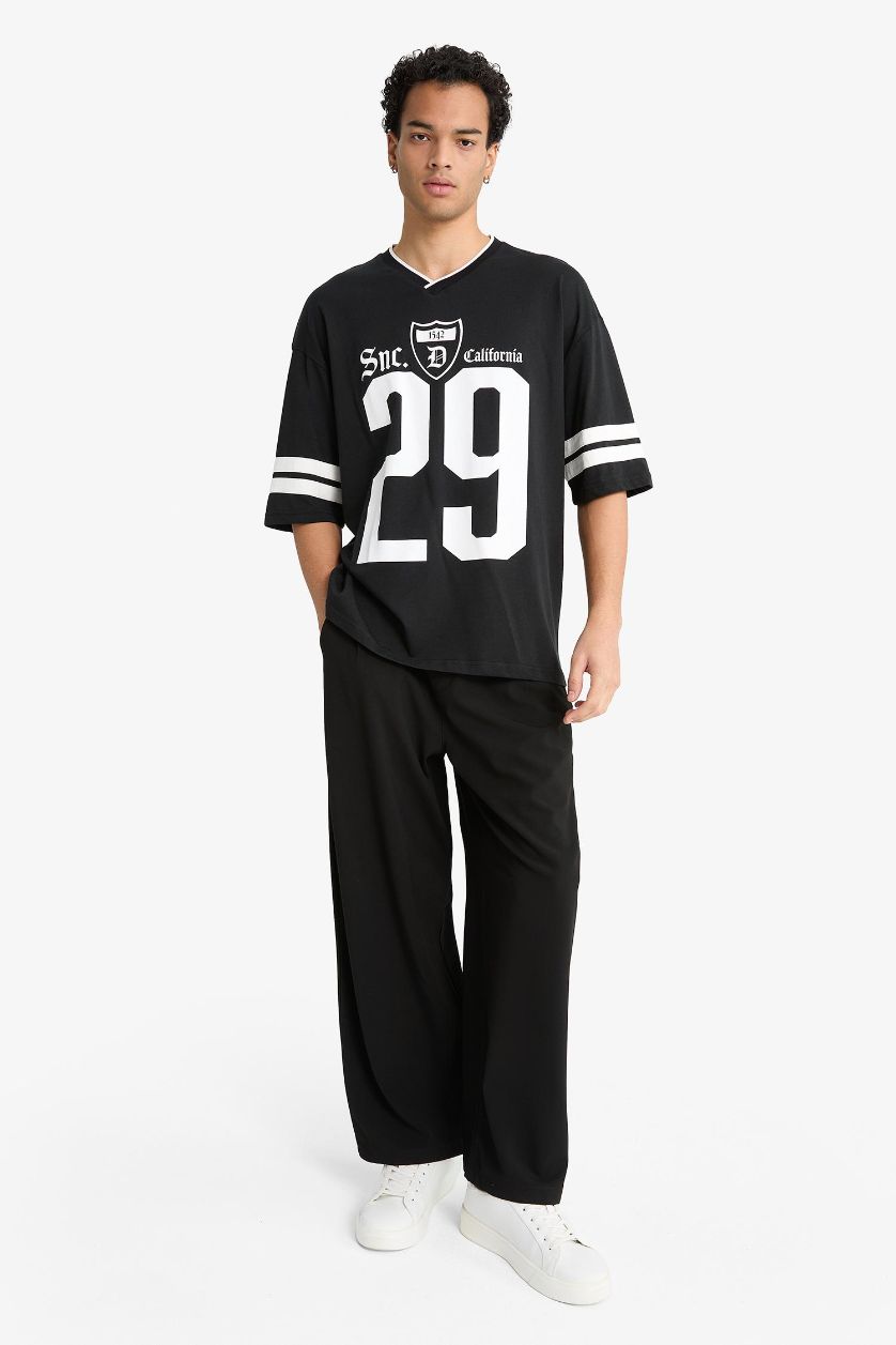 MAN Black Barrel Fit Wide Straight Leg Trousers