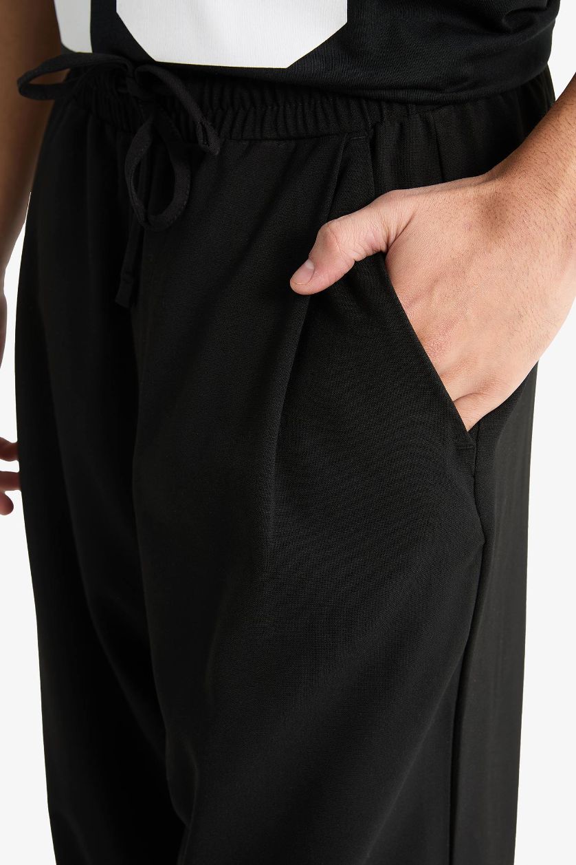 MAN Black Barrel Fit Wide Straight Leg Trousers