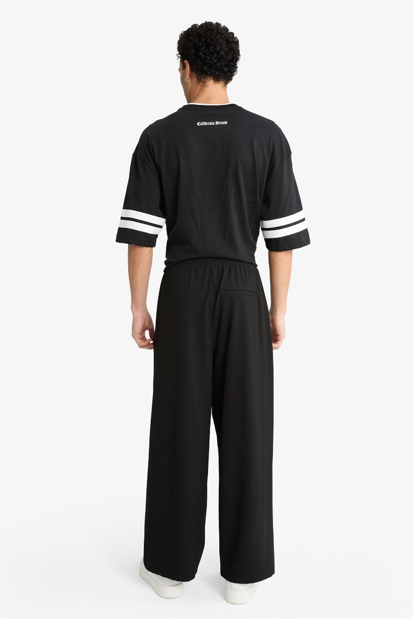 MAN Black Barrel Fit Wide Straight Leg Trousers