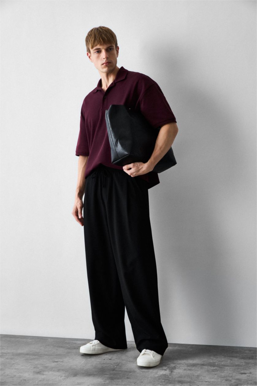 Man Black Barrel Fit Trousers