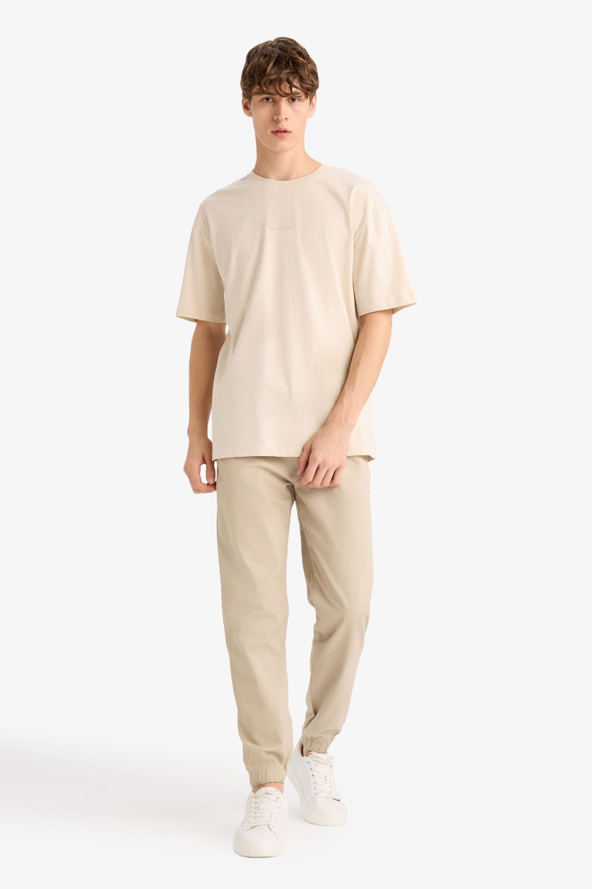 HOMME Beige T-shirt ample en coton imprimé au dos à col rond et manches courtes