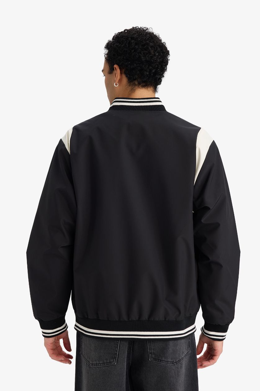 رجال أسود جاكيت اوفر سايز مقاوم للماء بياخة كوليج