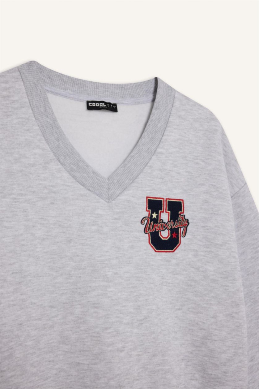 نساء ميلانج رمادي سويت شيرت مطرز قصة فضفاضة بياخة V