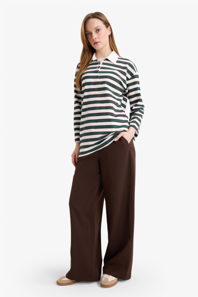 نساء بني سروال برجل عادي