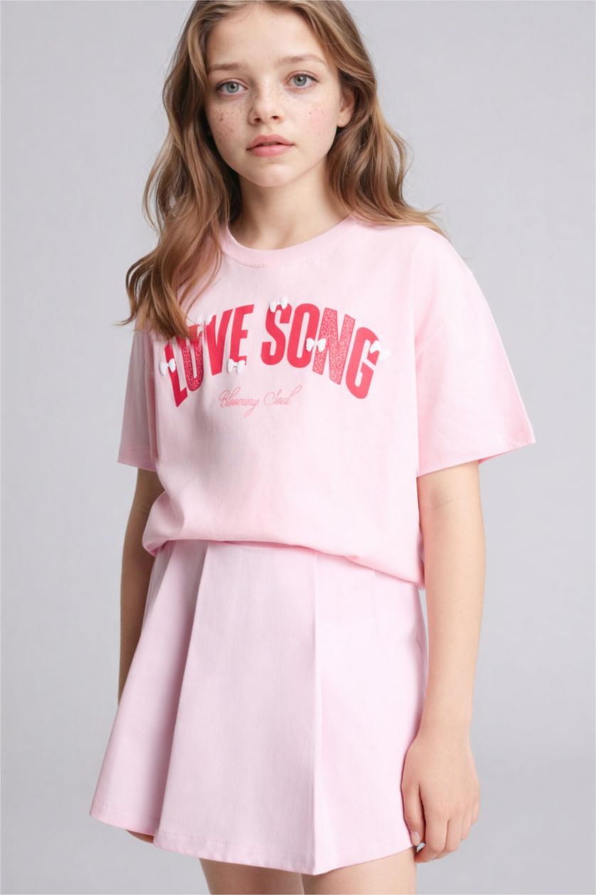 بنات زهري فاتح تيشيرت بناتي نص ردن بطبعة شعار اوفر سايز