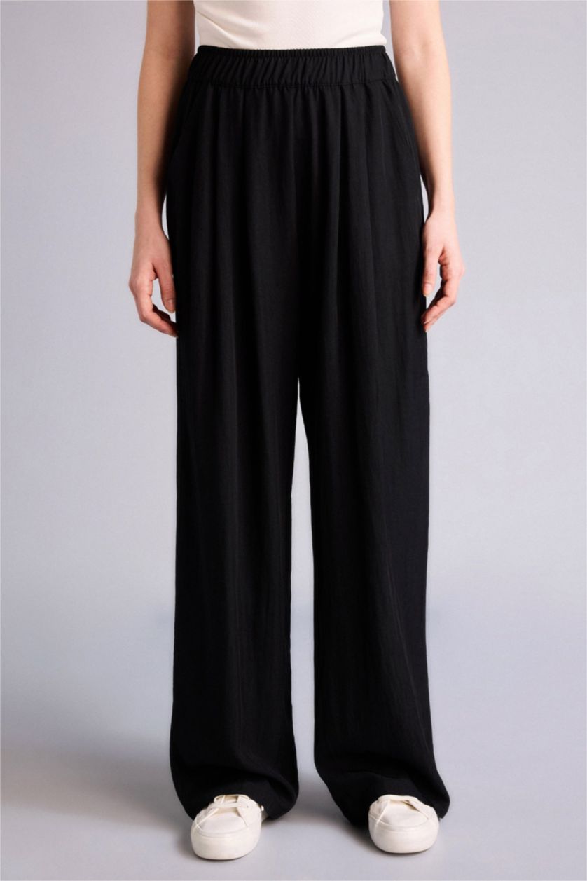 Әйелдерге қара кең аяқ Шалбар