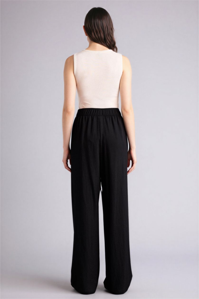 Әйелдерге қара кең аяқ Шалбар