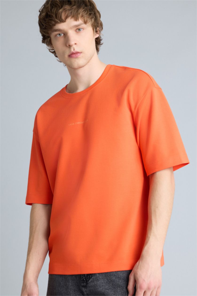 Ерлер қызғылт сары Тыныс алатын Boxy Fit баспалы футболка