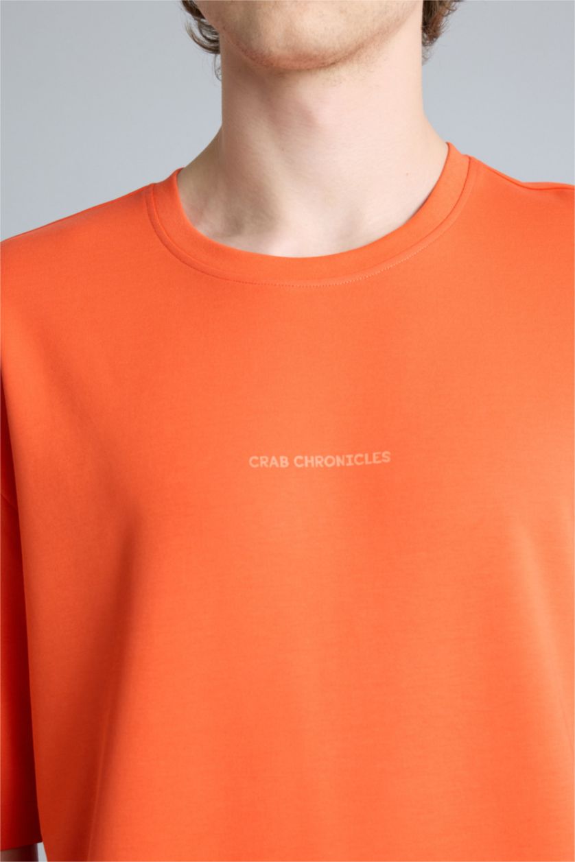 Ерлер қызғылт сары Тыныс алатын Boxy Fit баспалы футболка