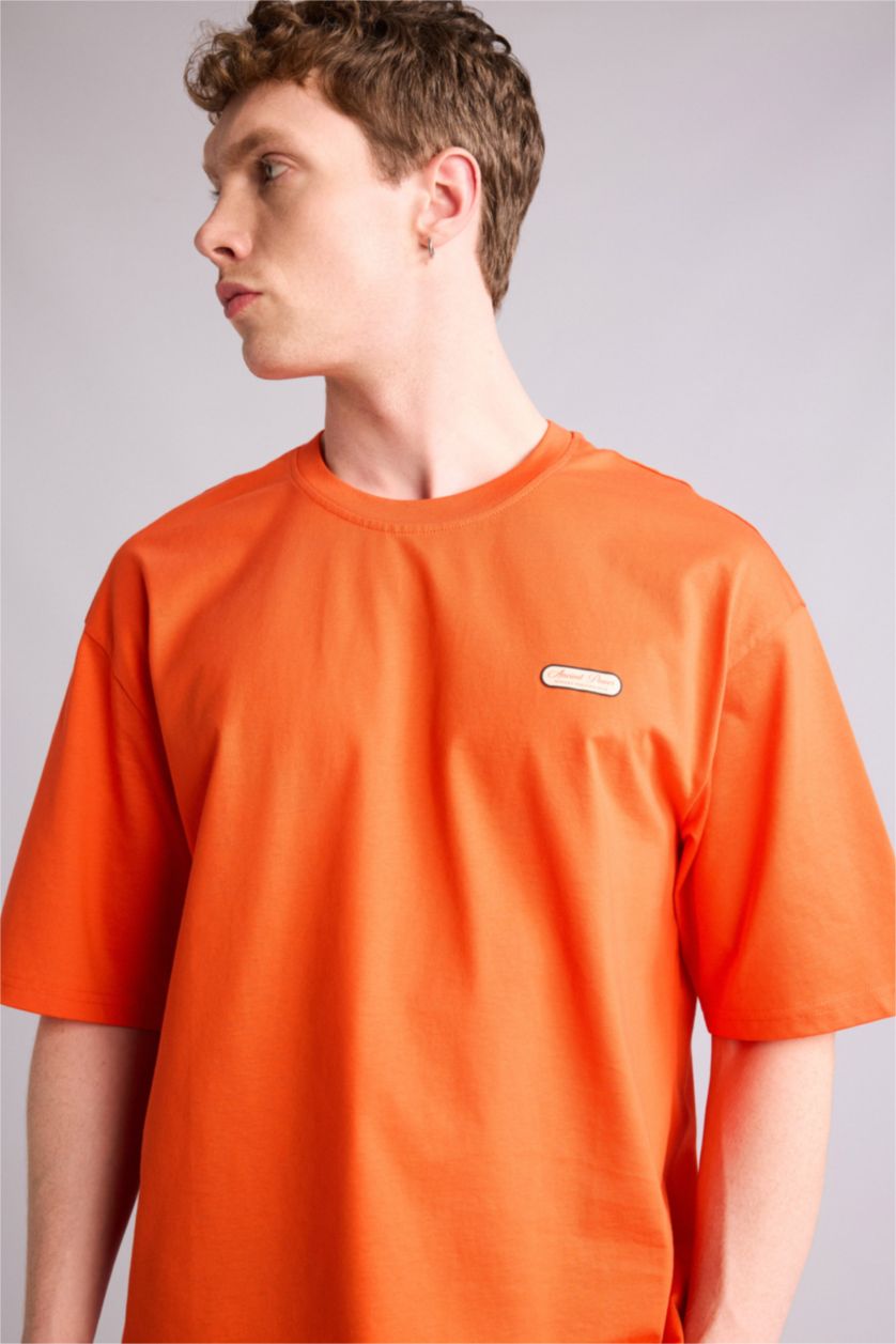 Ерлер қызғылт сары 100% мақта Boxy Fit баспалы футболка