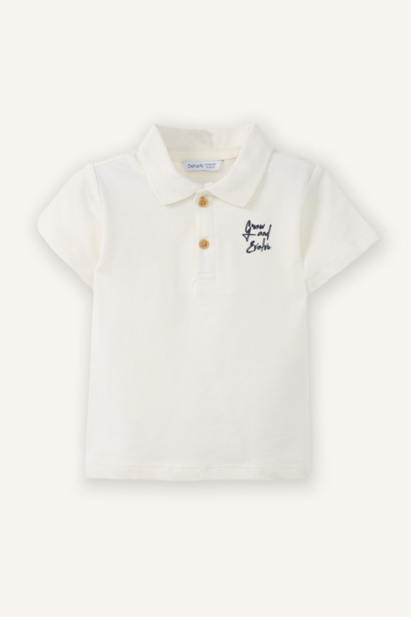 طفل صغير بيج فاتح تيشيرت بولو اولادي اوفر سايز نص كم بيكيه بطبعة شعار