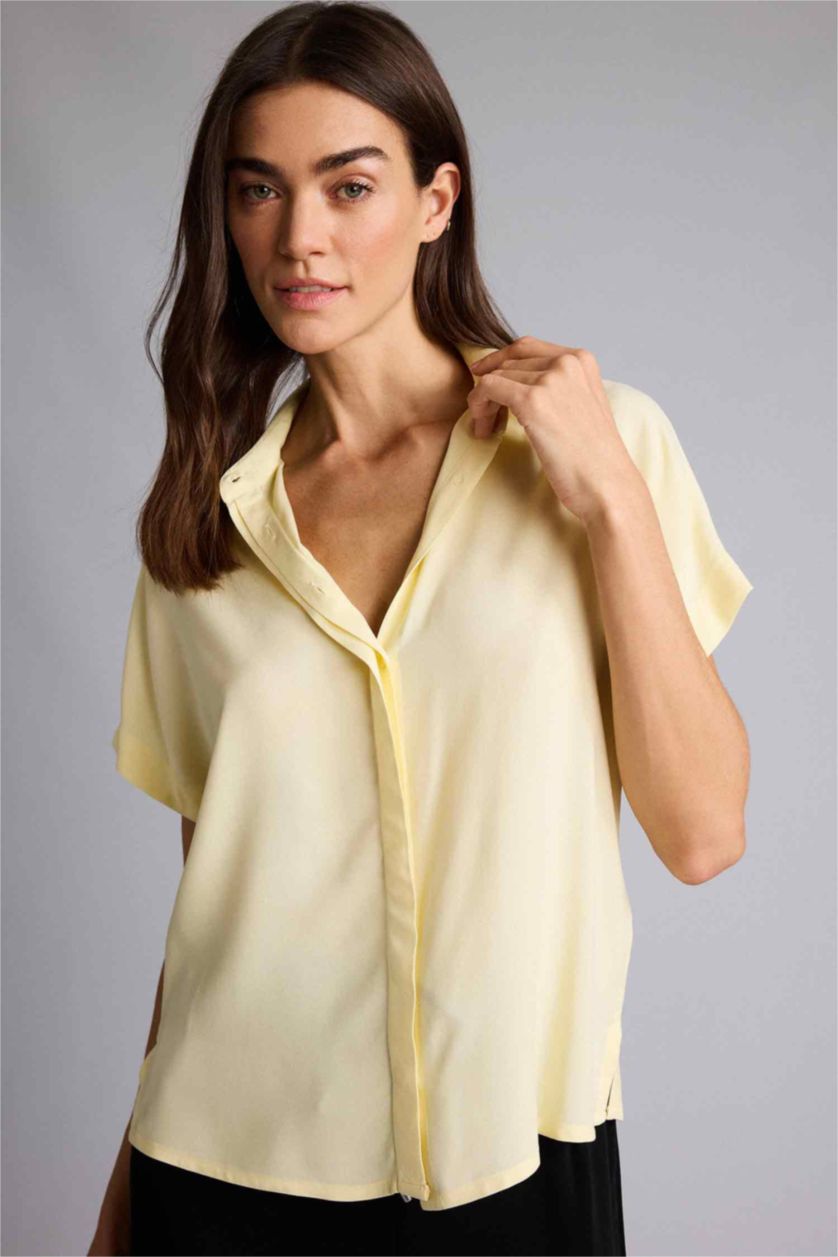 حريمي أصفر فاتح قميص نص كم قصة عادية