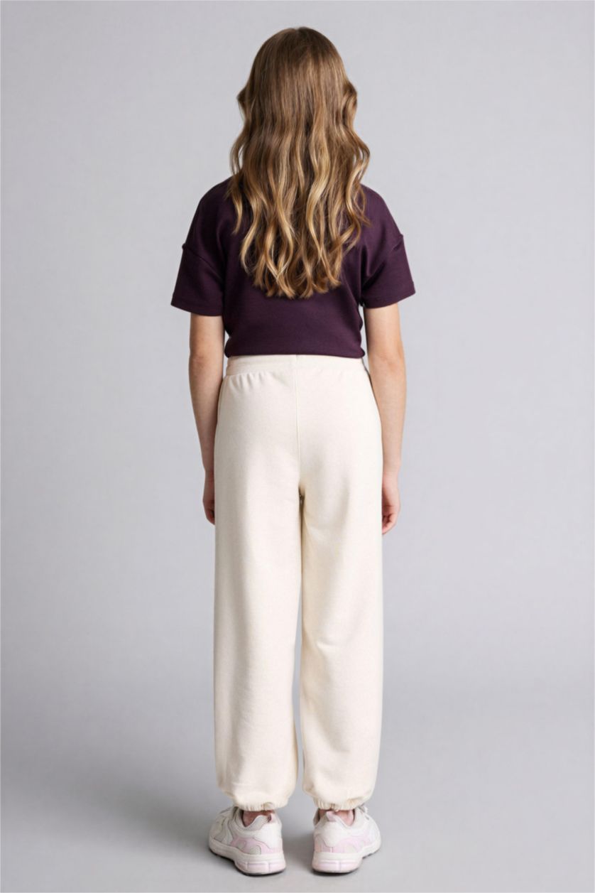 بنات بيج فاتح بنطلون بناتي