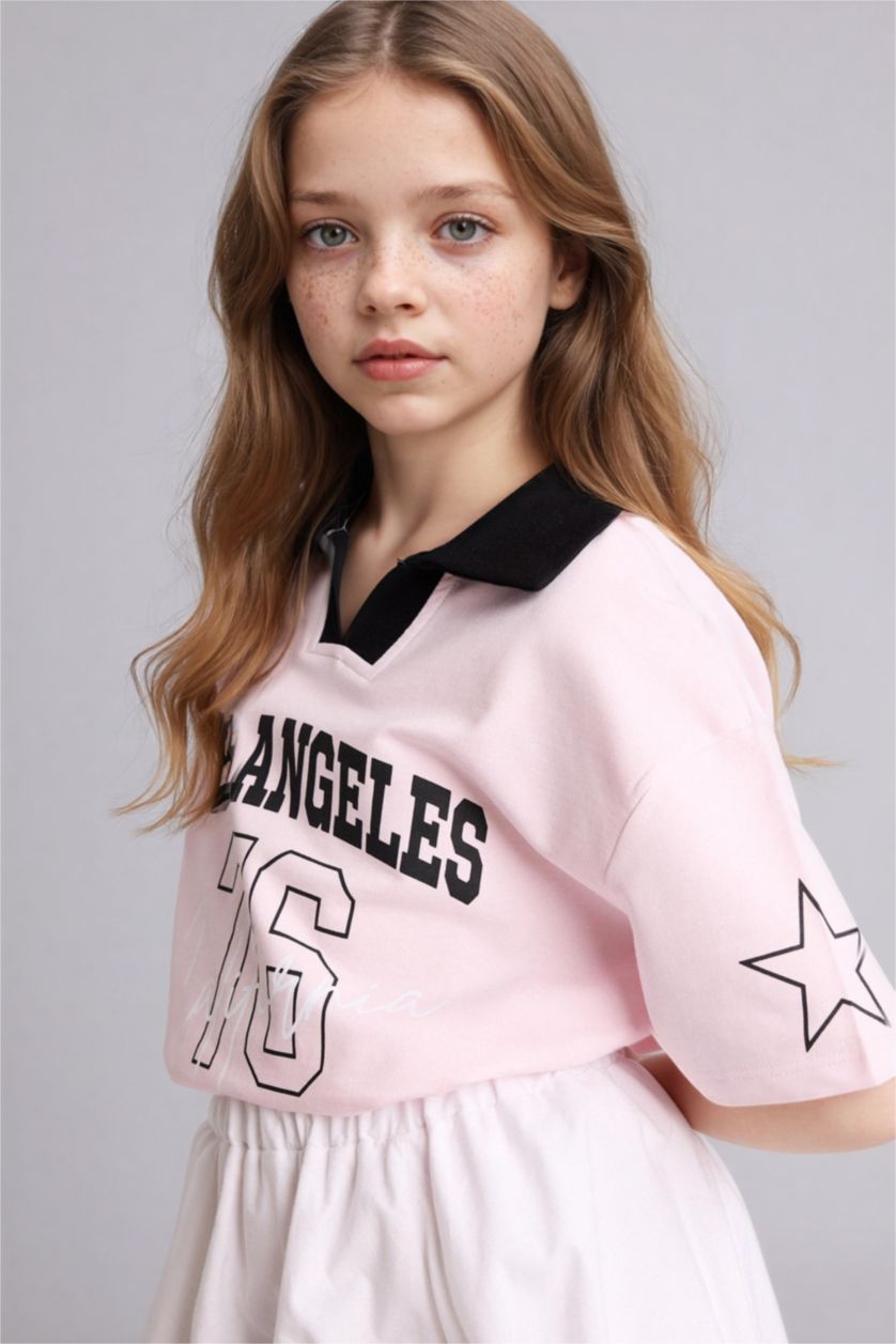 بنات زهري فاتح تيشيرت بولو بناتي اوفر سايز بطبعة شعار