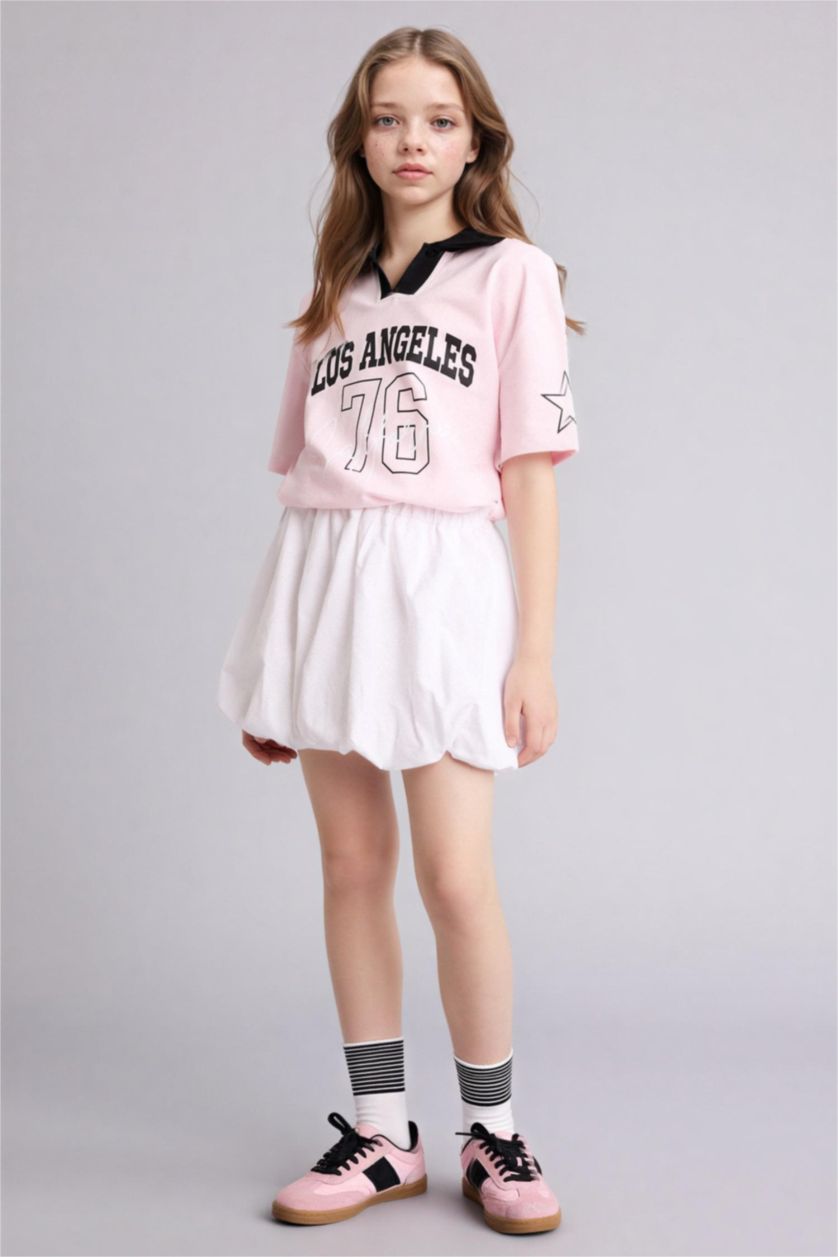 بنات زهري فاتح تيشيرت بولو بناتي اوفر سايز بطبعة شعار