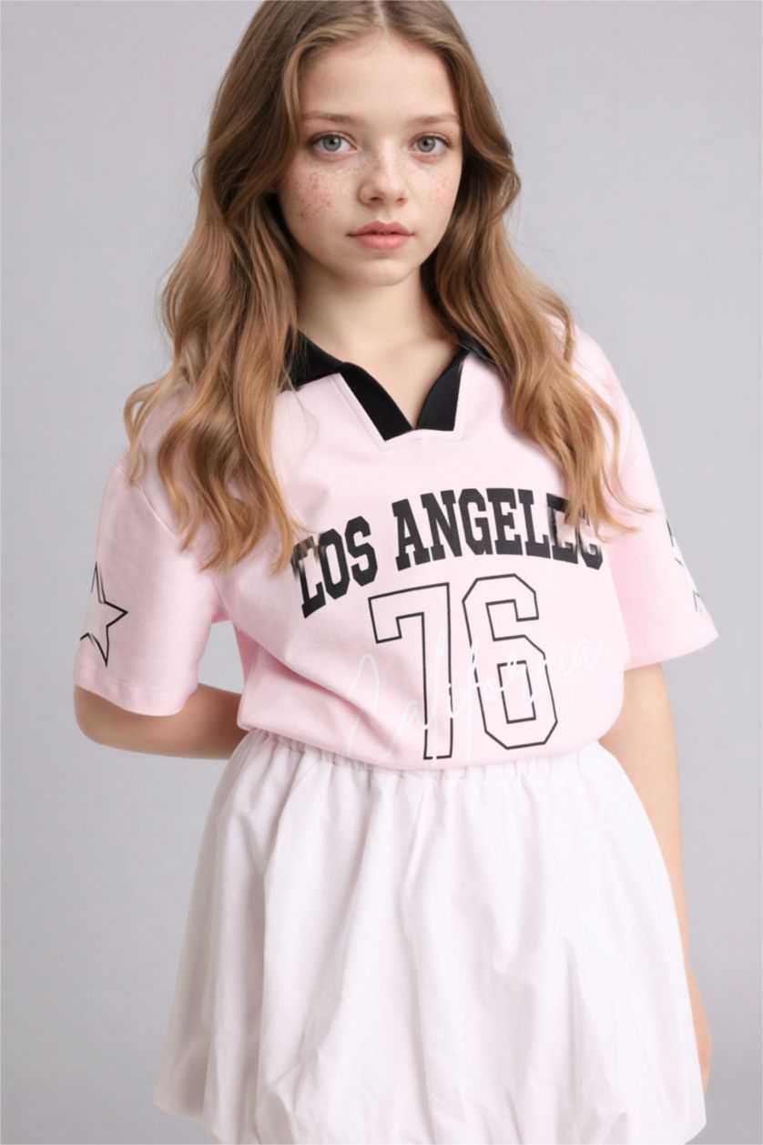 بنات زهري فاتح تيشيرت بولو بناتي اوفر سايز بطبعة شعار