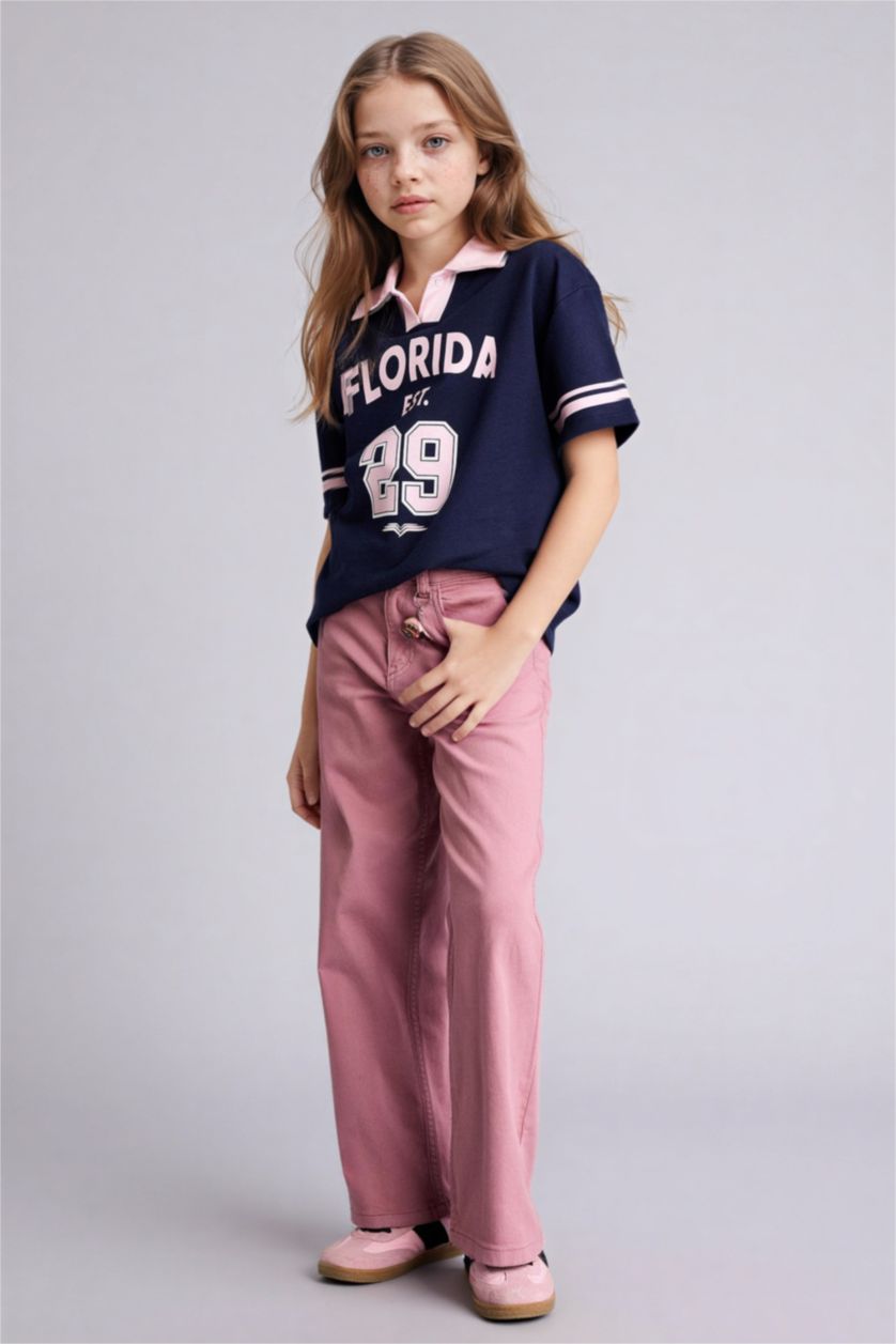 بنات كحلي تيشيرت بولو بناتي اوفر سايز بطبعة شعار