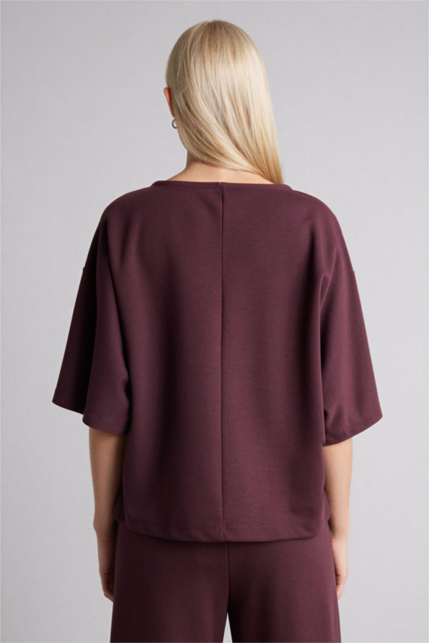 نساء بني تيشيرت ردن طويل وياخة عريضة