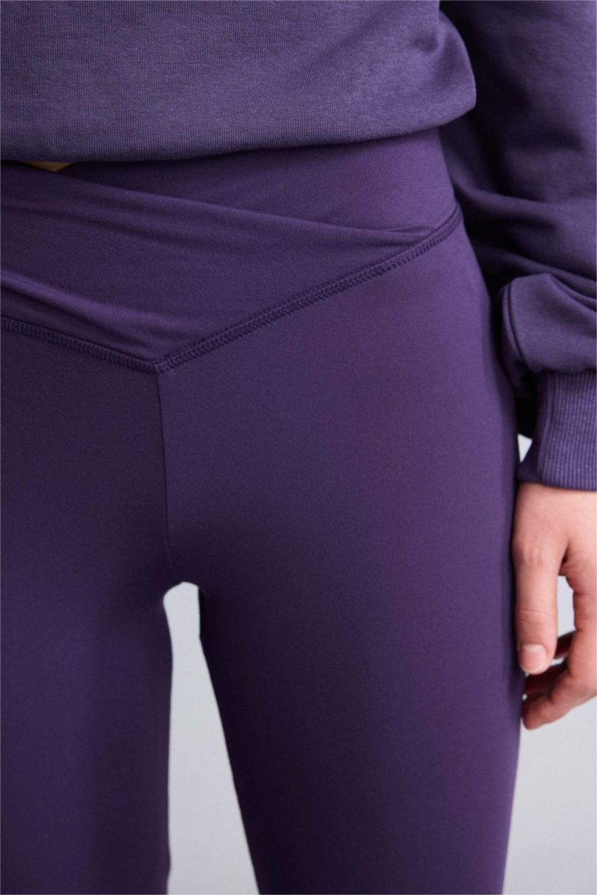 نساء بنفسجي توب بيزك سادة