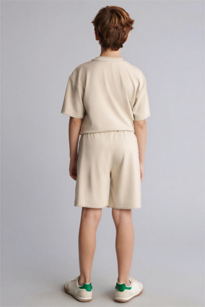 أولاد بيج شورت ولادي اوفر سايز بطبعة شعار