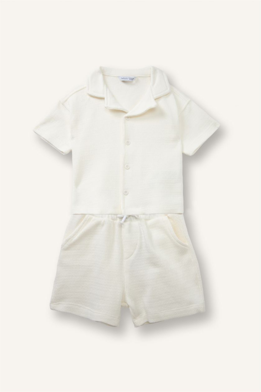 طفل صغير بيج فاتح سيت جاكار بياقة بولو من قطعتين