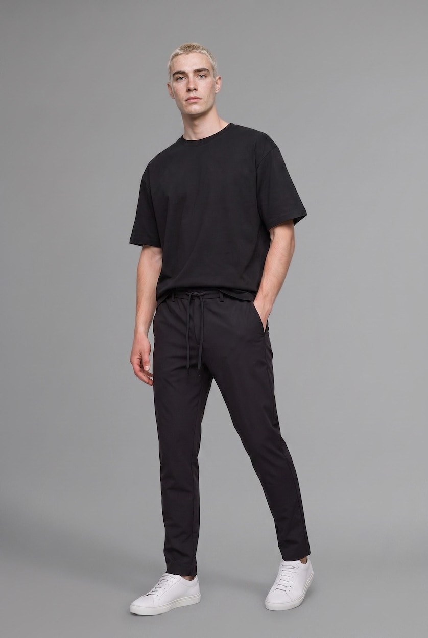 MAN Black Relaxed Fit Straight Leg Trousers