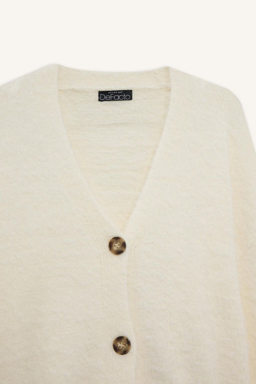 حريمي بيج فاتح كارديجان تريكو اوفر سايز بياقة V