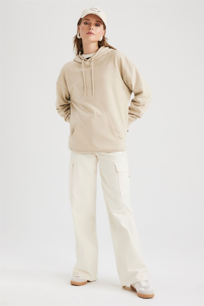 حريمي بيج فاتح سويت شيرت أوفر سايز  بأكمام طويلة بغطاء للرأس