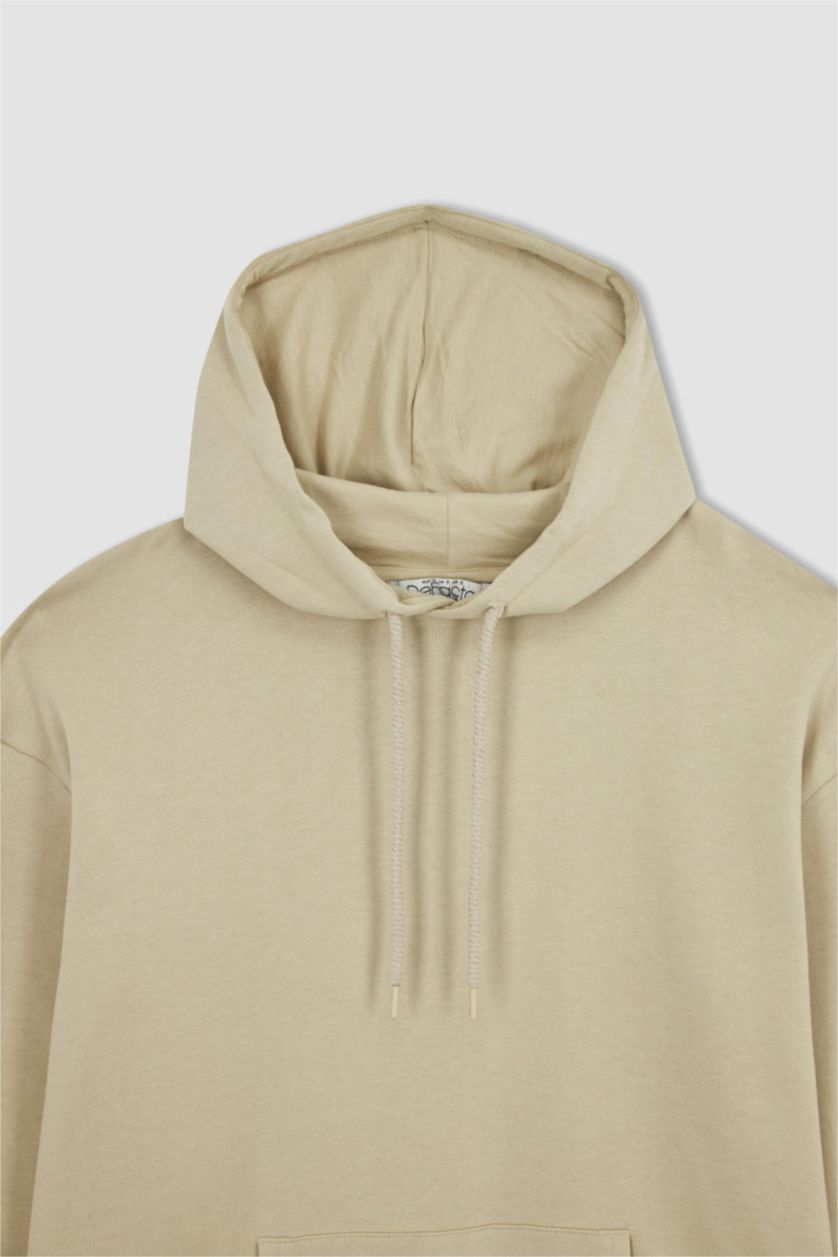 حريمي بيج فاتح سويت شيرت أوفر سايز  بأكمام طويلة بغطاء للرأس