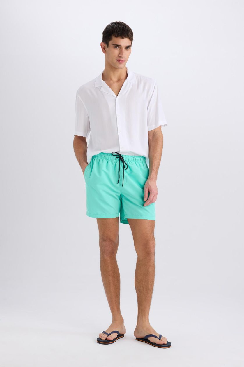 HOMME Bleu Short de bain court avec doublure filet