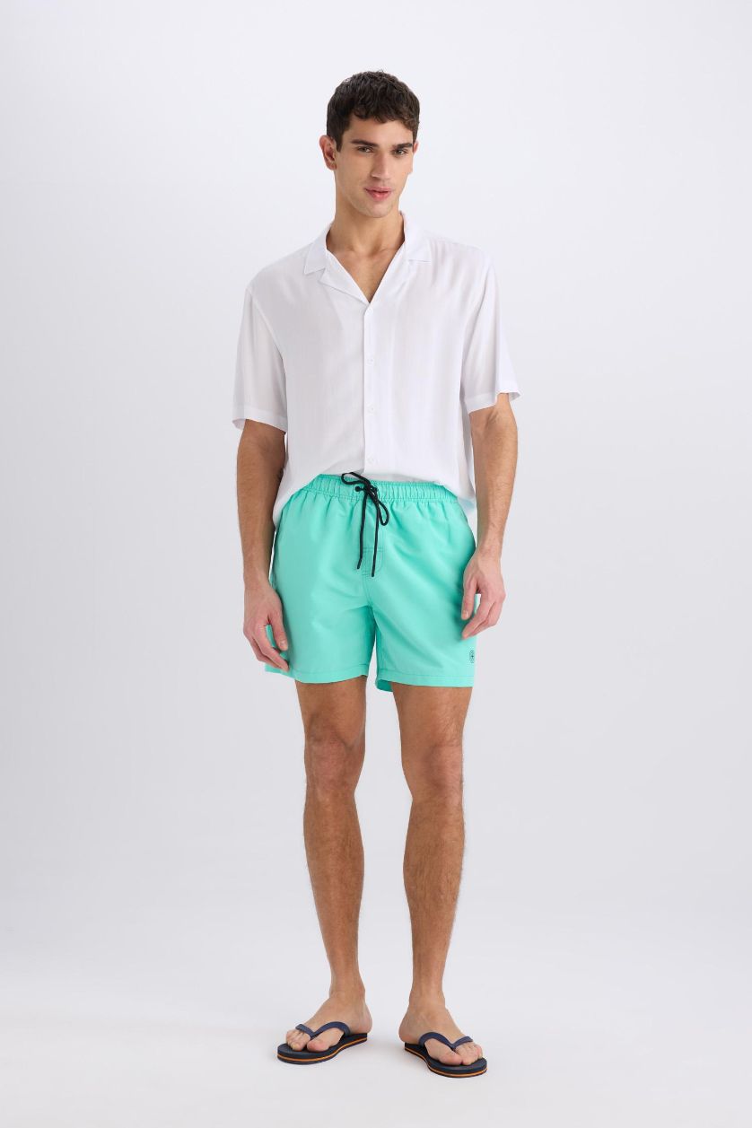 HOMME Bleu Short de bain court avec doublure filet