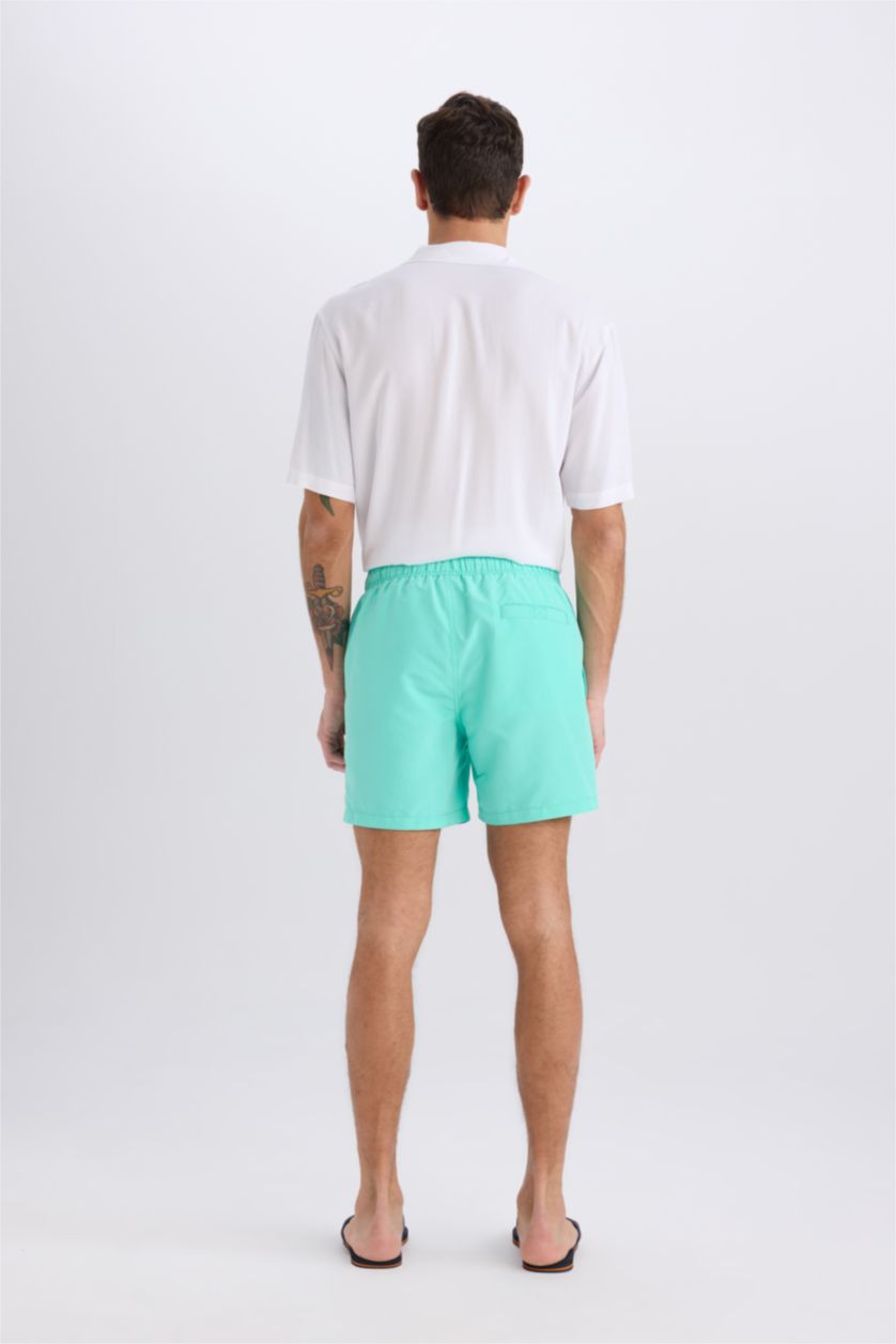 HOMME Bleu Short de bain court avec doublure filet