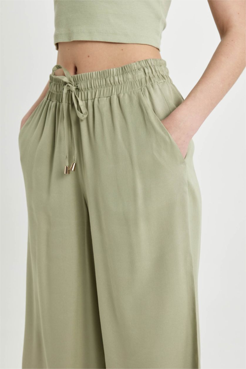 حريمي كاكي فاتح كابري كروب فيت فيسكوز بخصر عالي